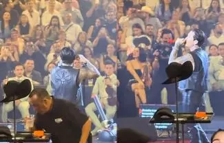 Un video viral muestra al staff de Christian Nodal oliendo y retirando sus bebidas en un concierto; usuarios especulan que buscan controlar su consumo